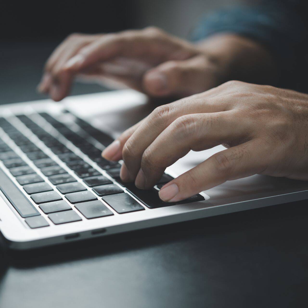 hands-typing-on-a-laptop