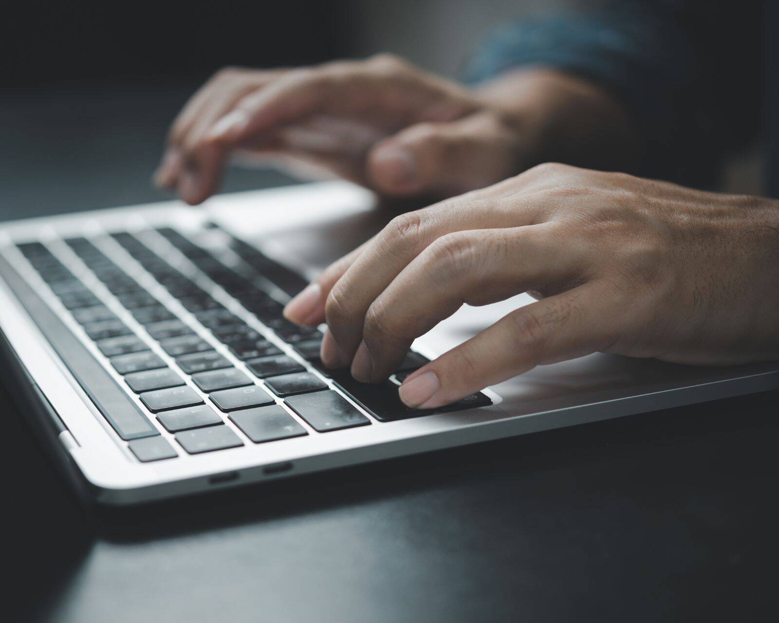 hands-typing-on-a-laptop