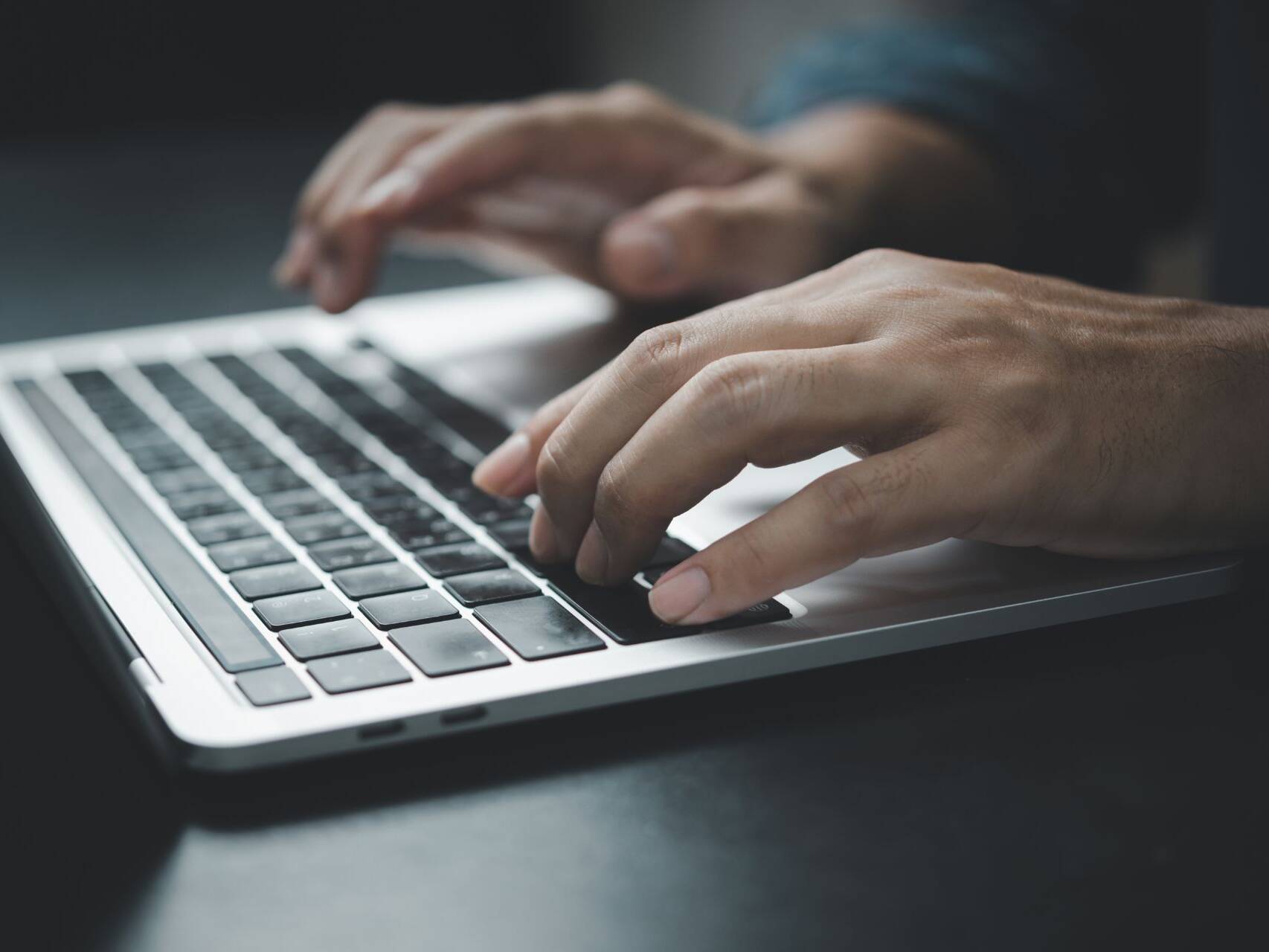 hands-typing-on-a-laptop