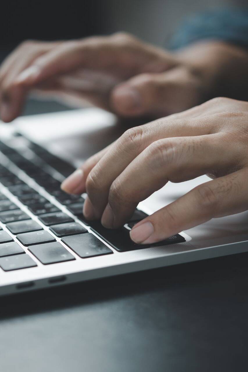 hands-typing-on-a-laptop